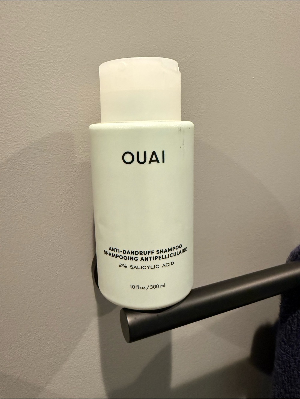 OUAI Anti-Dandruff Shampoo in Mint Green and White